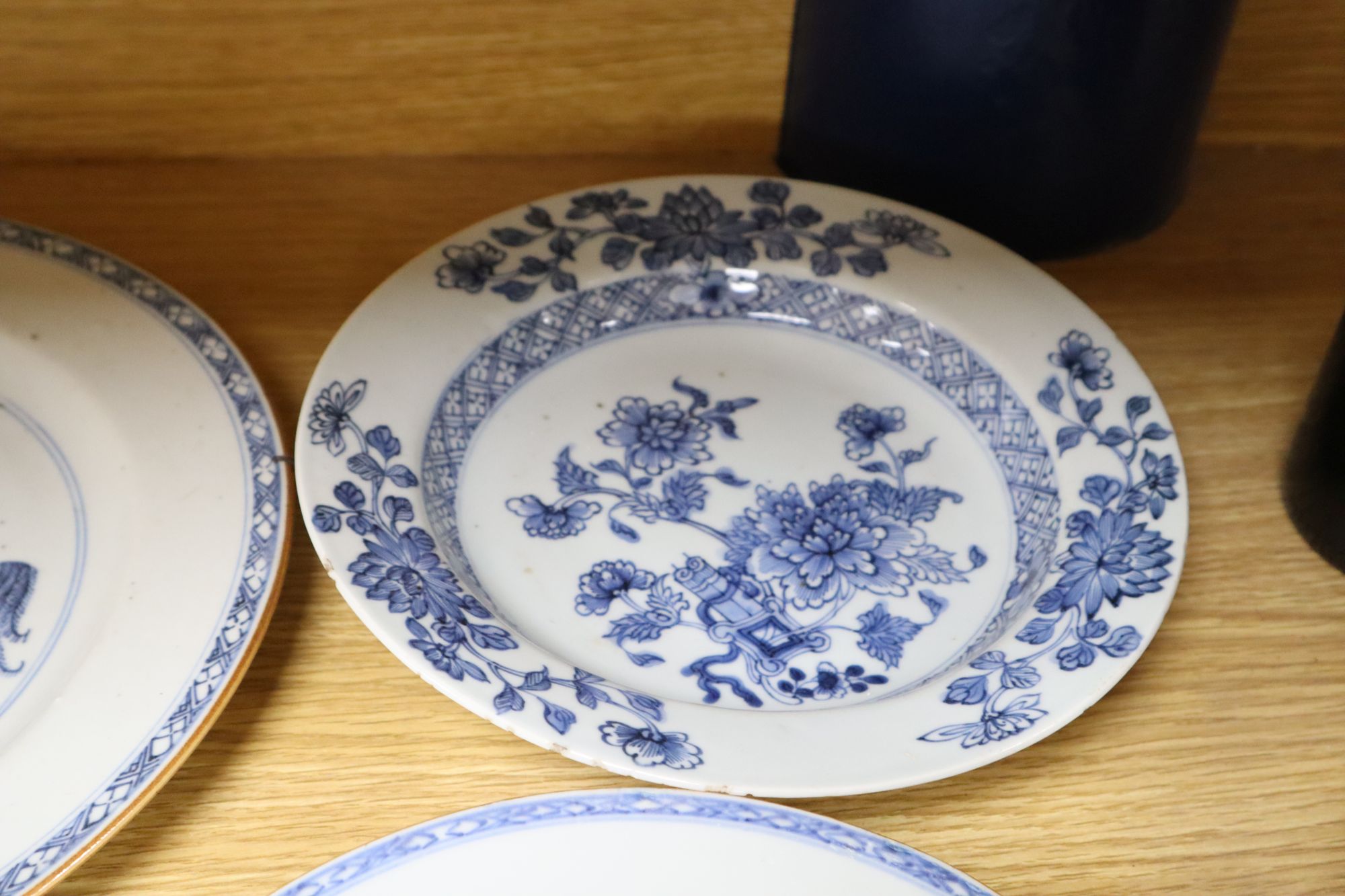 A collection of mostly 18th century Chinese export plates and dishes, a Chinese famille rose dish and another similar smaller dish